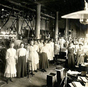 people standing on the floor of a newspaper room